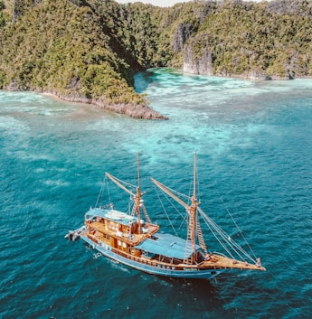 a boat floating in the middle of a body of water