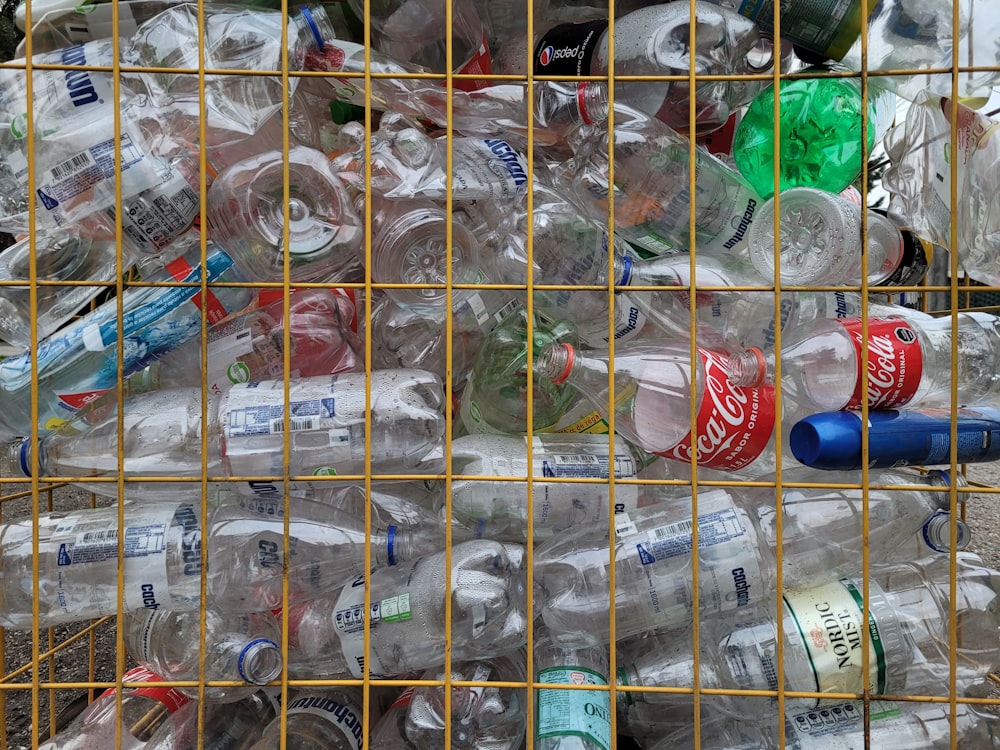 a bunch of bottles that are in a cage