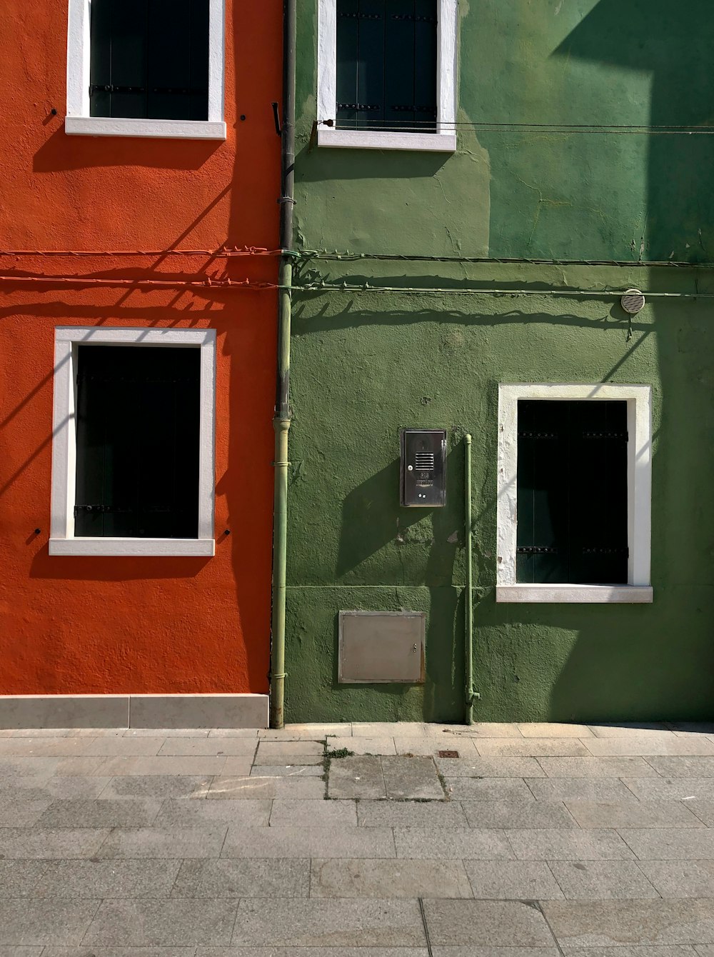 a red and green building next to each other