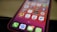 A close-up of a smartphone screen displaying a variety of applications, arranged in a grid pattern. The apps have distinct icons and include names like Agenda, TickTick, and Udemy. The background is blurred, highlighting the focus on the phone's display.