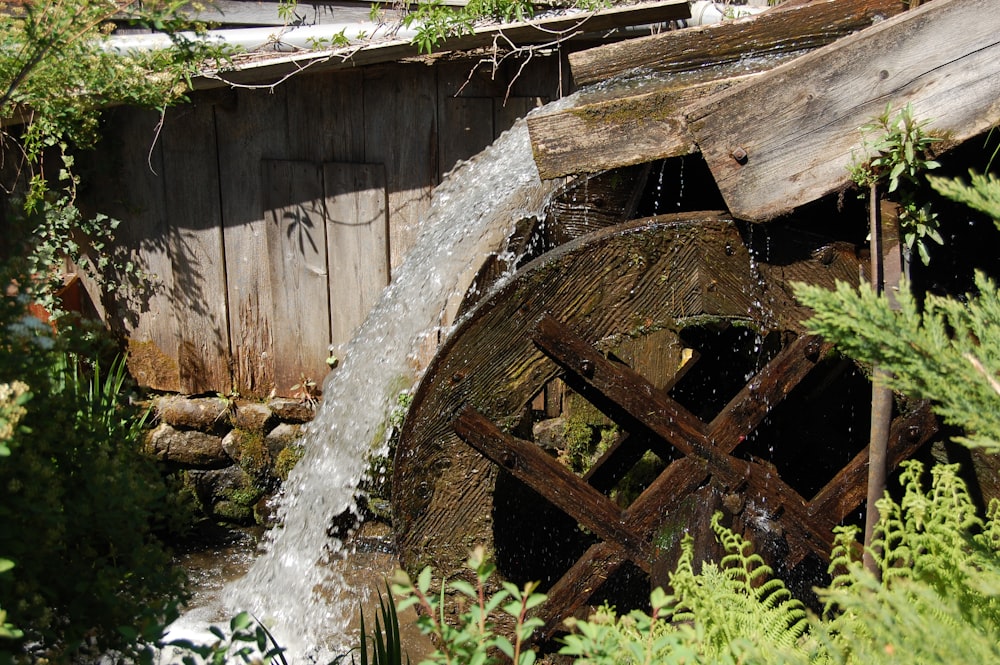 a water wheel with water coming out of it