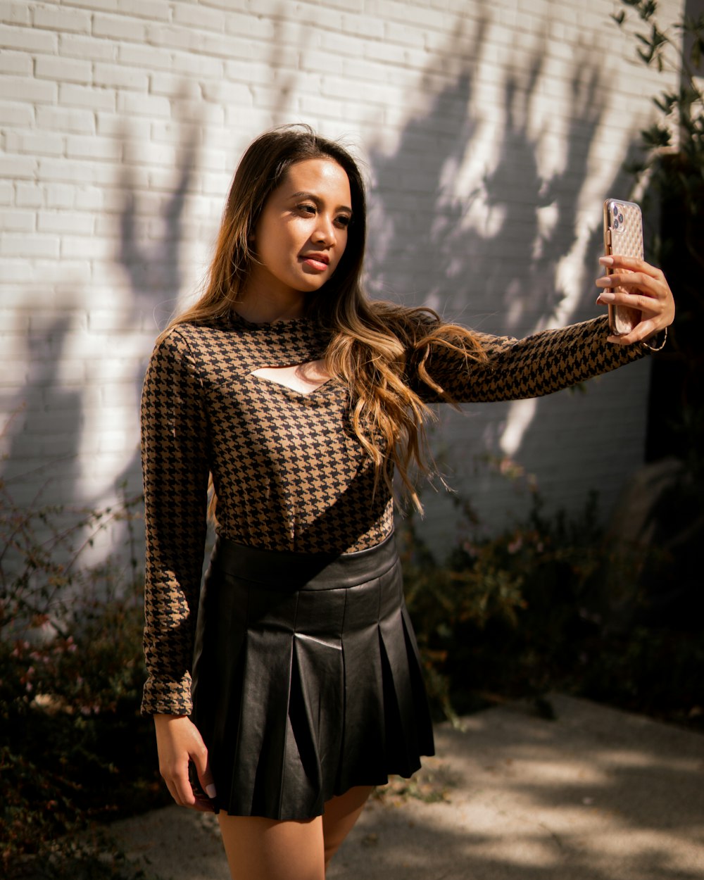 a woman taking a selfie with her cell phone