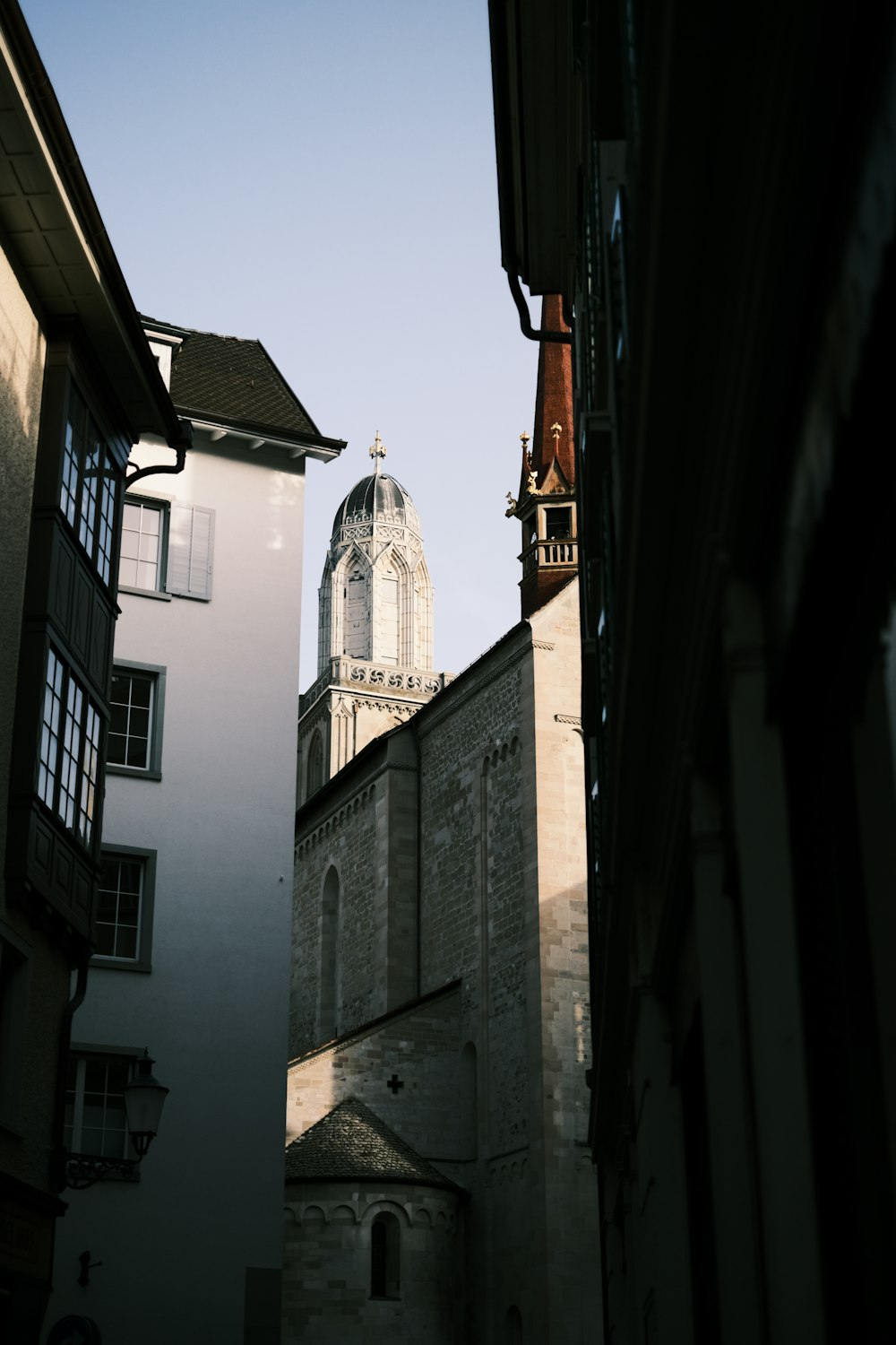 a view of a church from a narrow alley way