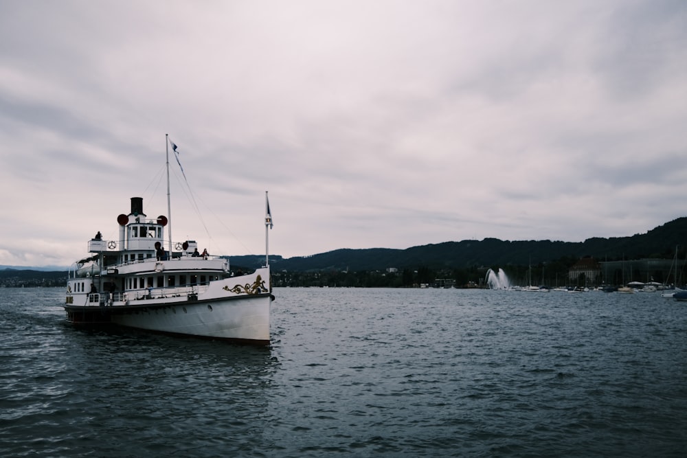 a large boat floating on top of a large body of water