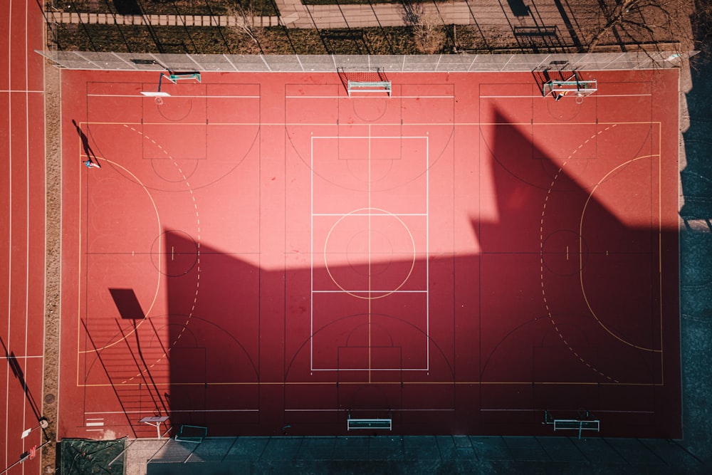 an overhead view of a basketball court with benches