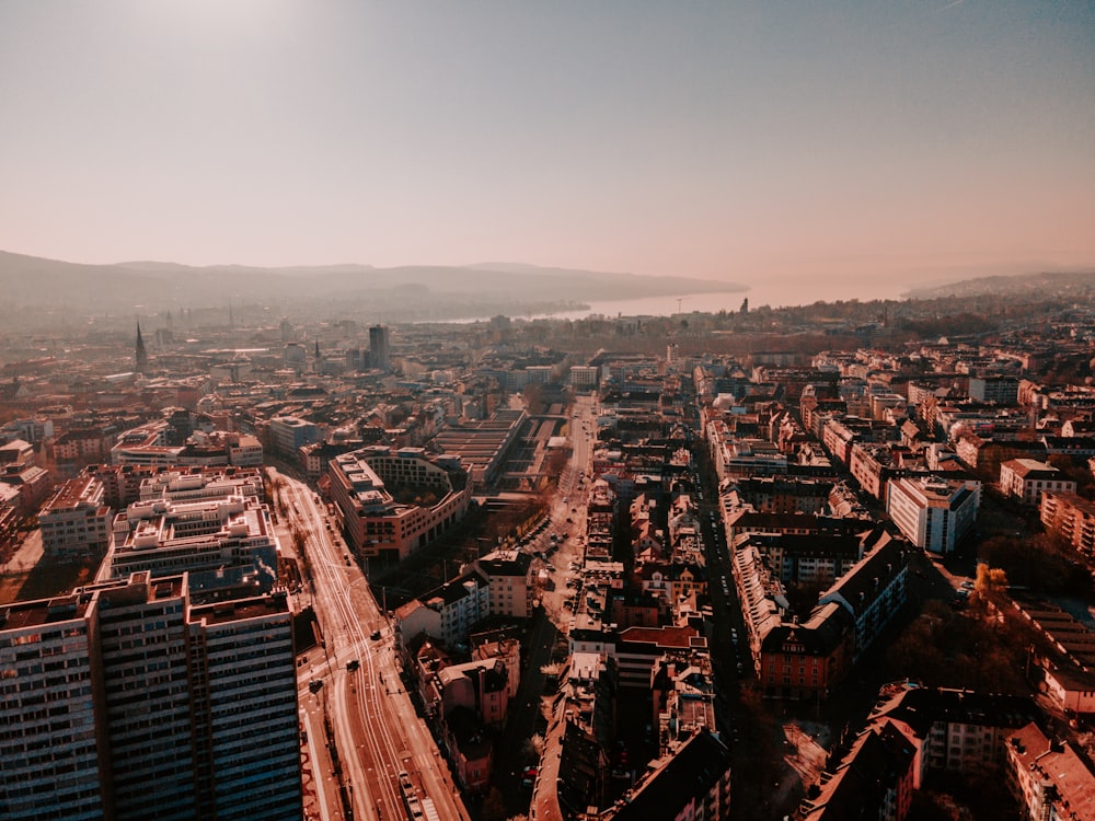 an aerial view of a city with tall buildings