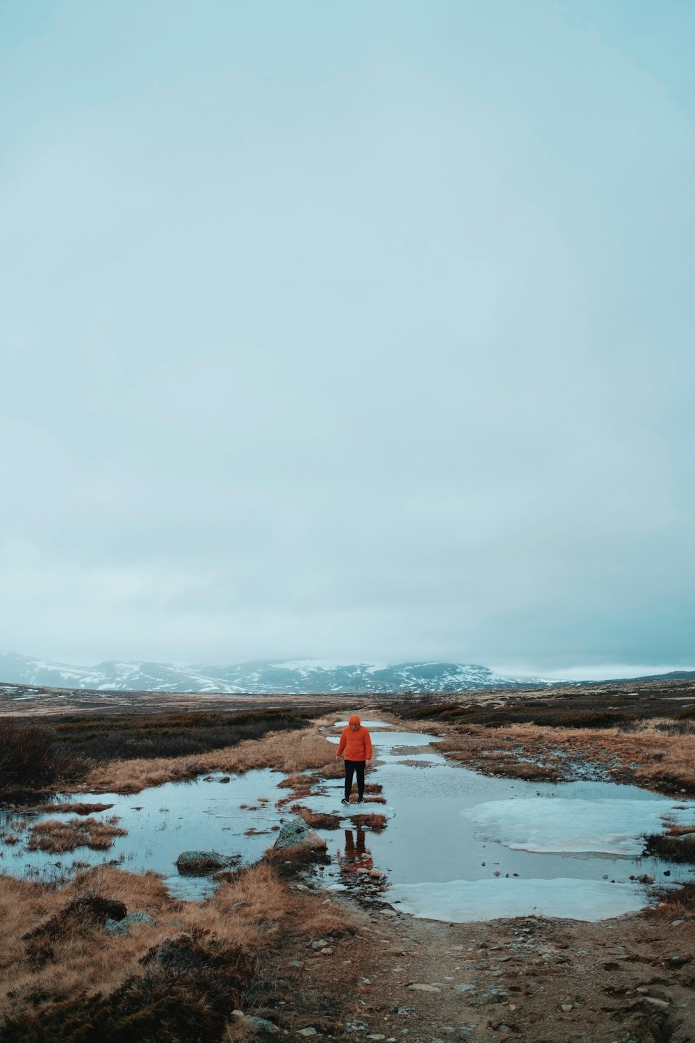 a person standing in a puddle of water