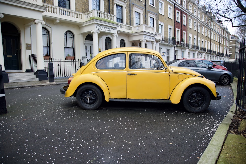 a yellow car parked on the side of the road