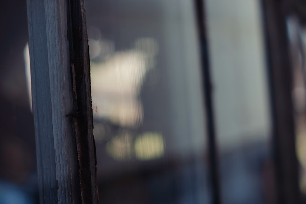 a close up of a window with a blurry background