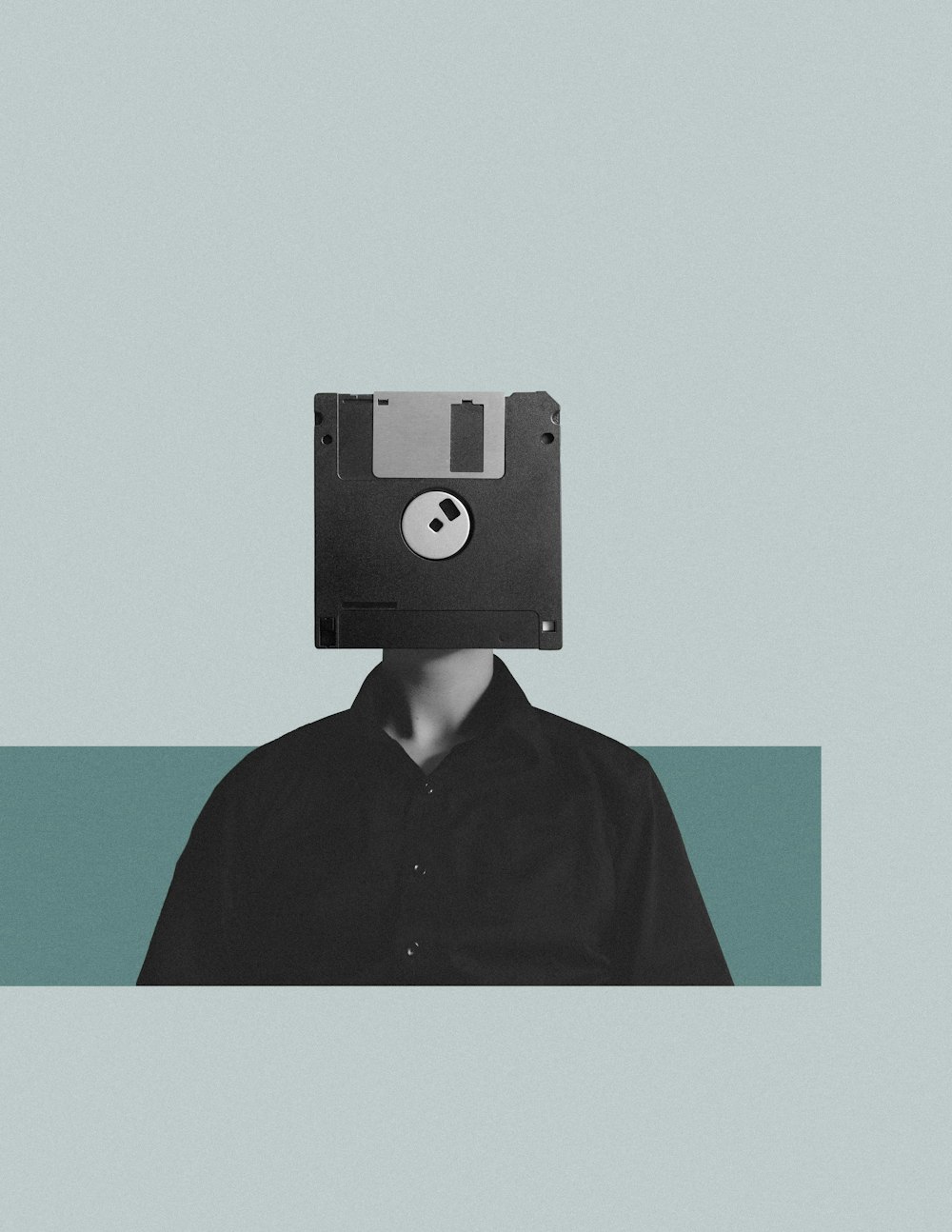 a man with a floppy head and a floppy disk on his head