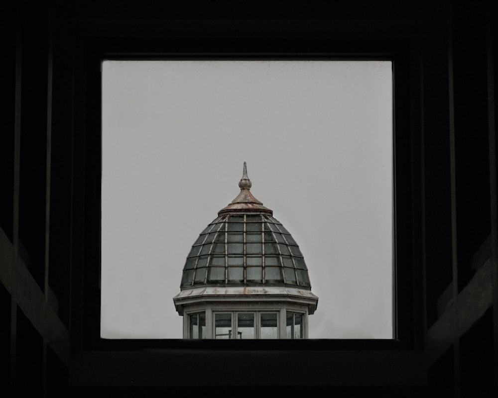 a view of the top of a building through a window