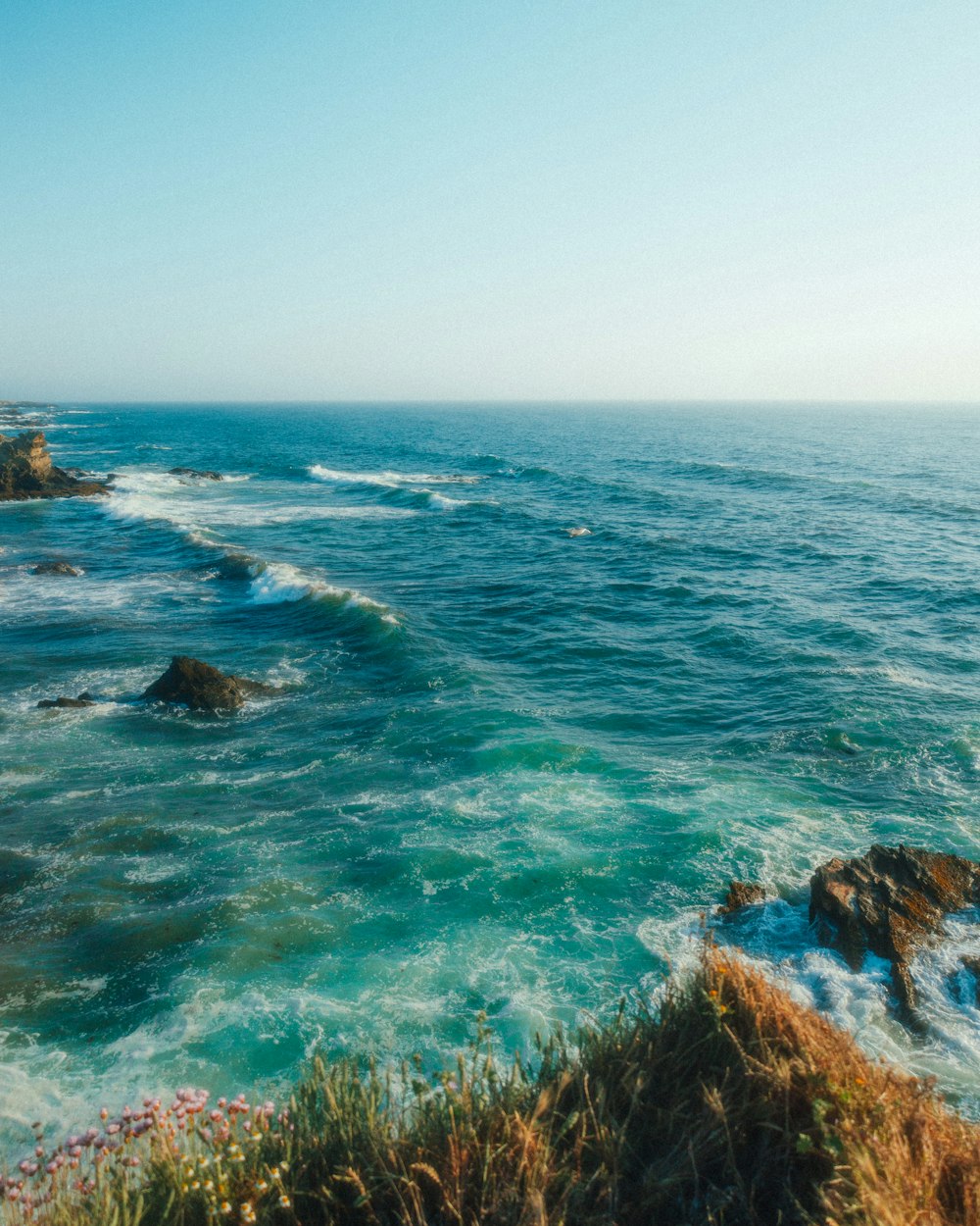 a view of the ocean from a cliff