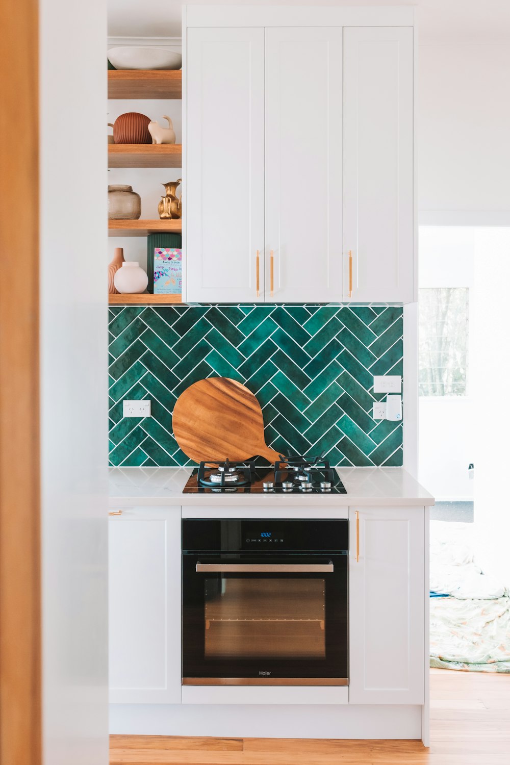 a stove top oven sitting inside of a kitchen