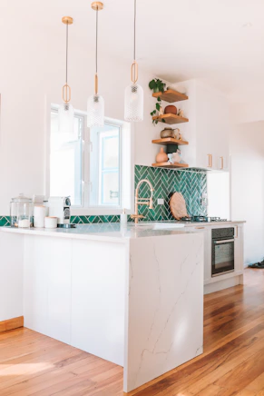 a kitchen with a marble island in the middle of it