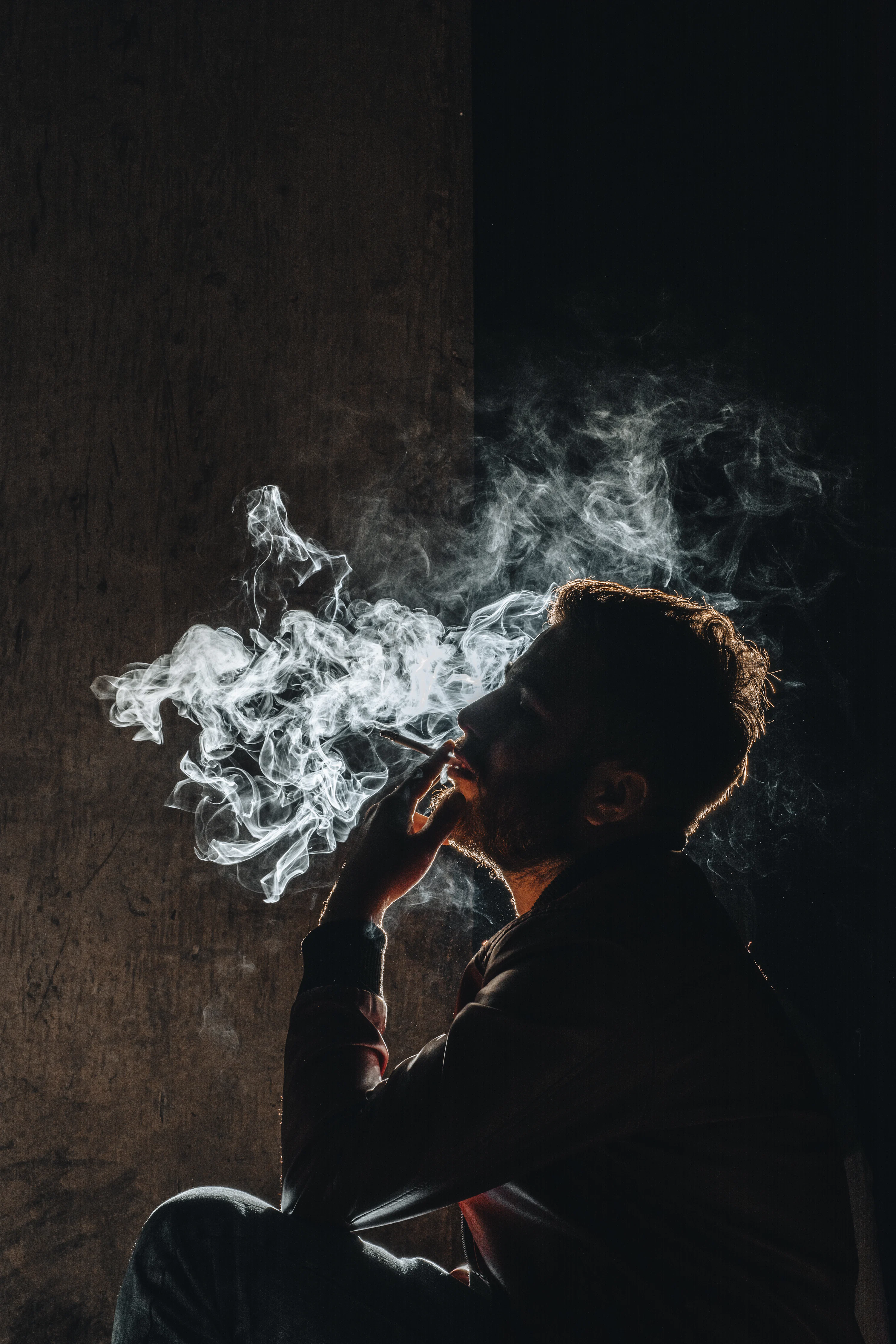 man smoking cigarette images A man smoking a cigarette in the dark photo – Free Man Image on Unsplash