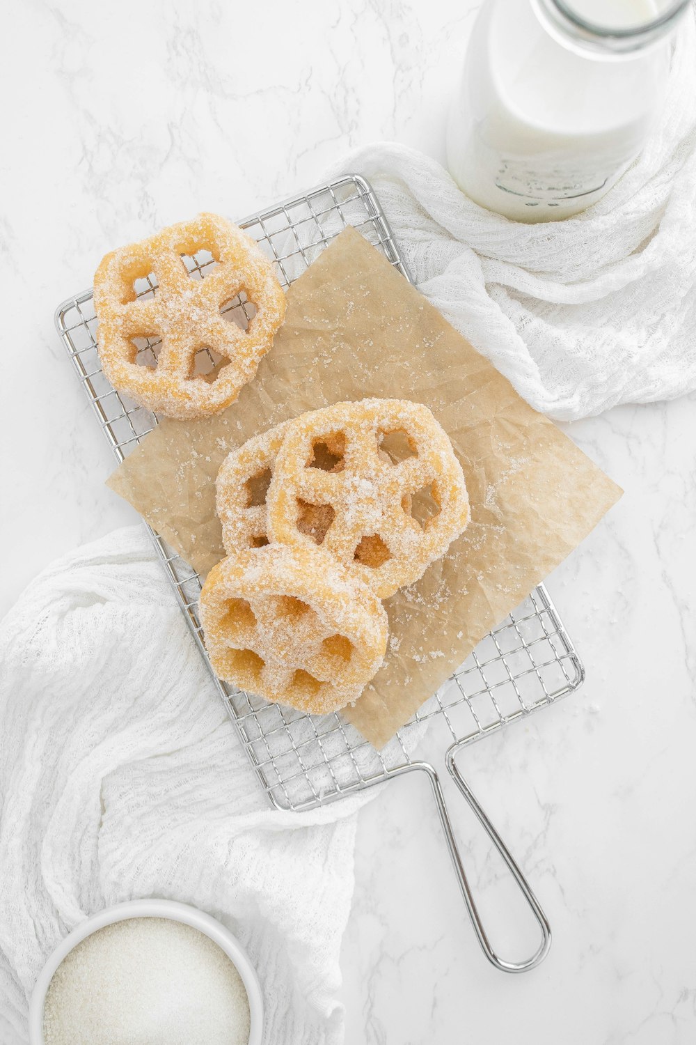 a couple of doughnuts sitting on top of a cooling rack