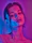 Portrait tattoo of a woman’s face on upper arm with vibrant colors and sharp lines, studio neon lights softly glowing