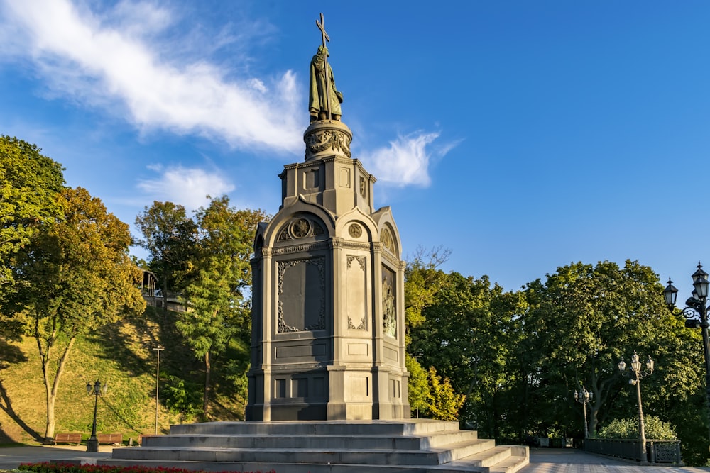 a monument with a statue on top of it