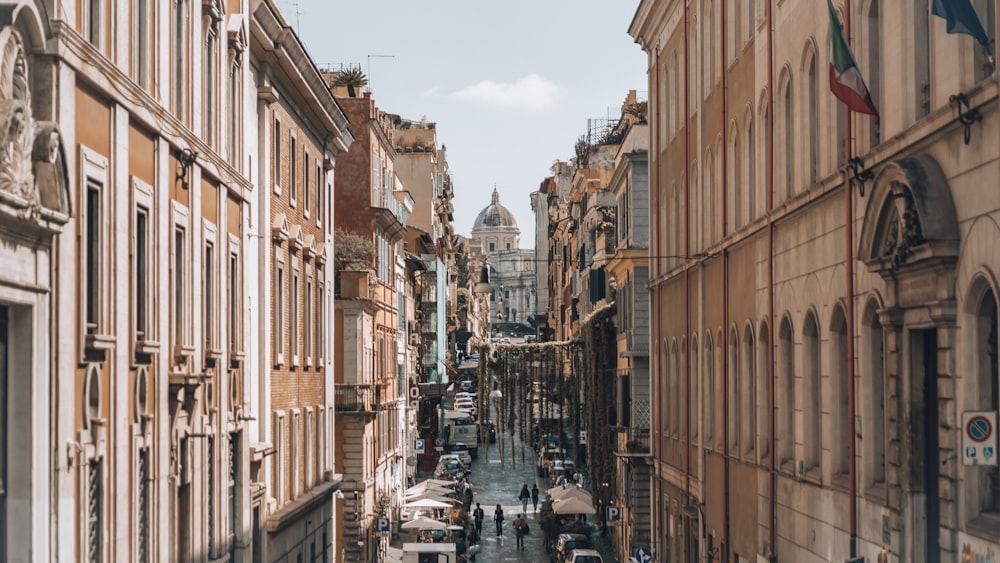 a narrow city street lined with tall buildings