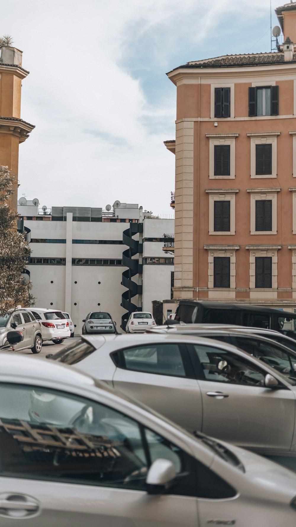 a bunch of cars that are parked in a lot