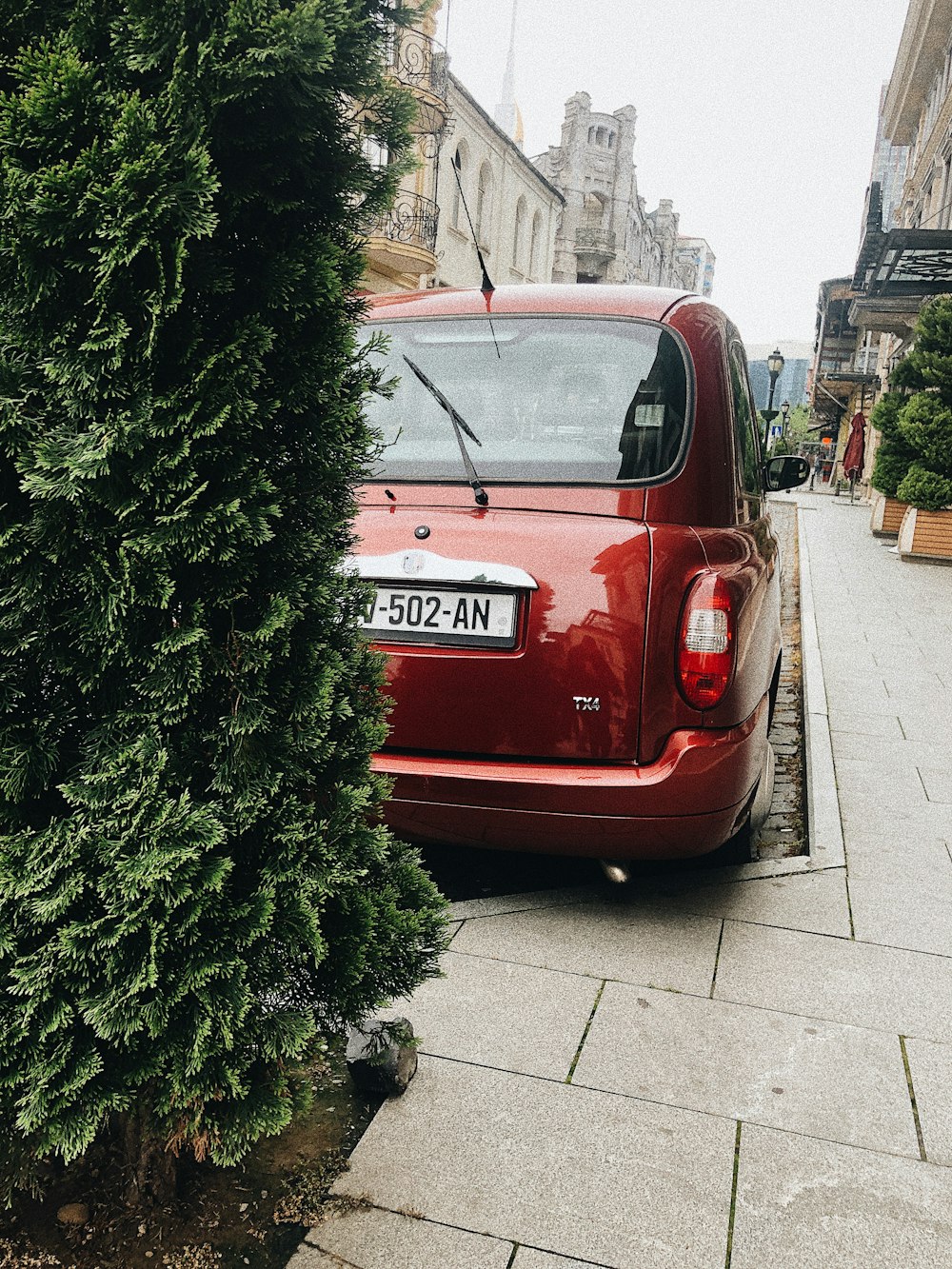 a red car parked on the side of the road