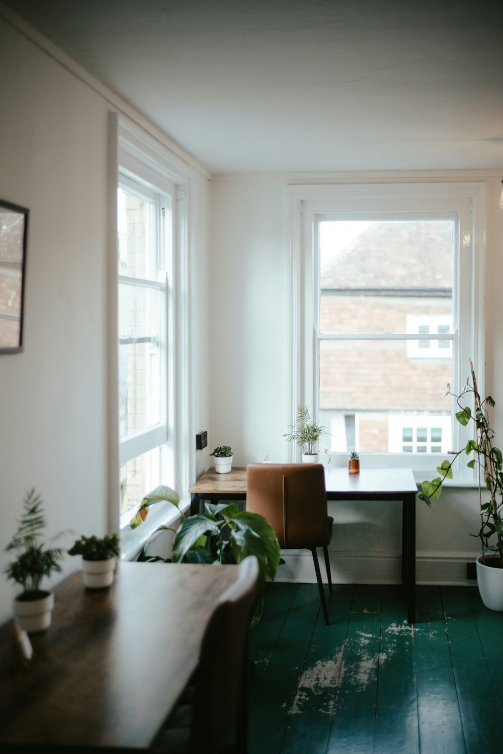 a living room filled with furniture and a large window