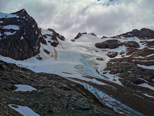A snow covered mountain with a glacier in the foreground — Ushuaia & Tierra del Fuego, Argentina