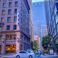 A bustling city street showing a fleet of well-maintained transportation vehicles under Future City's management.