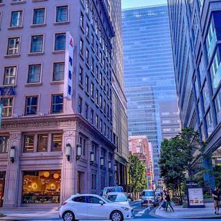 A bustling city street showing a fleet of well-maintained transportation vehicles under Future City's management.