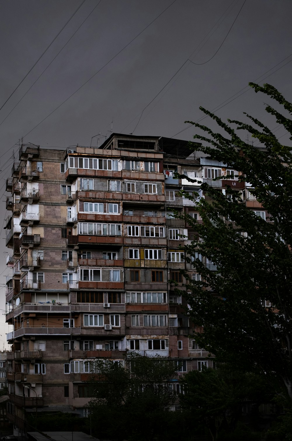 a tall building with lots of windows and balconies