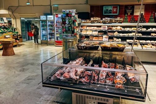 a display case in a store filled with lots of food