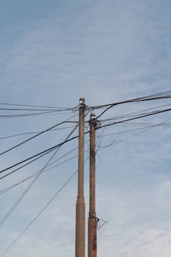 a telephone pole with a bunch of wires attached to it
