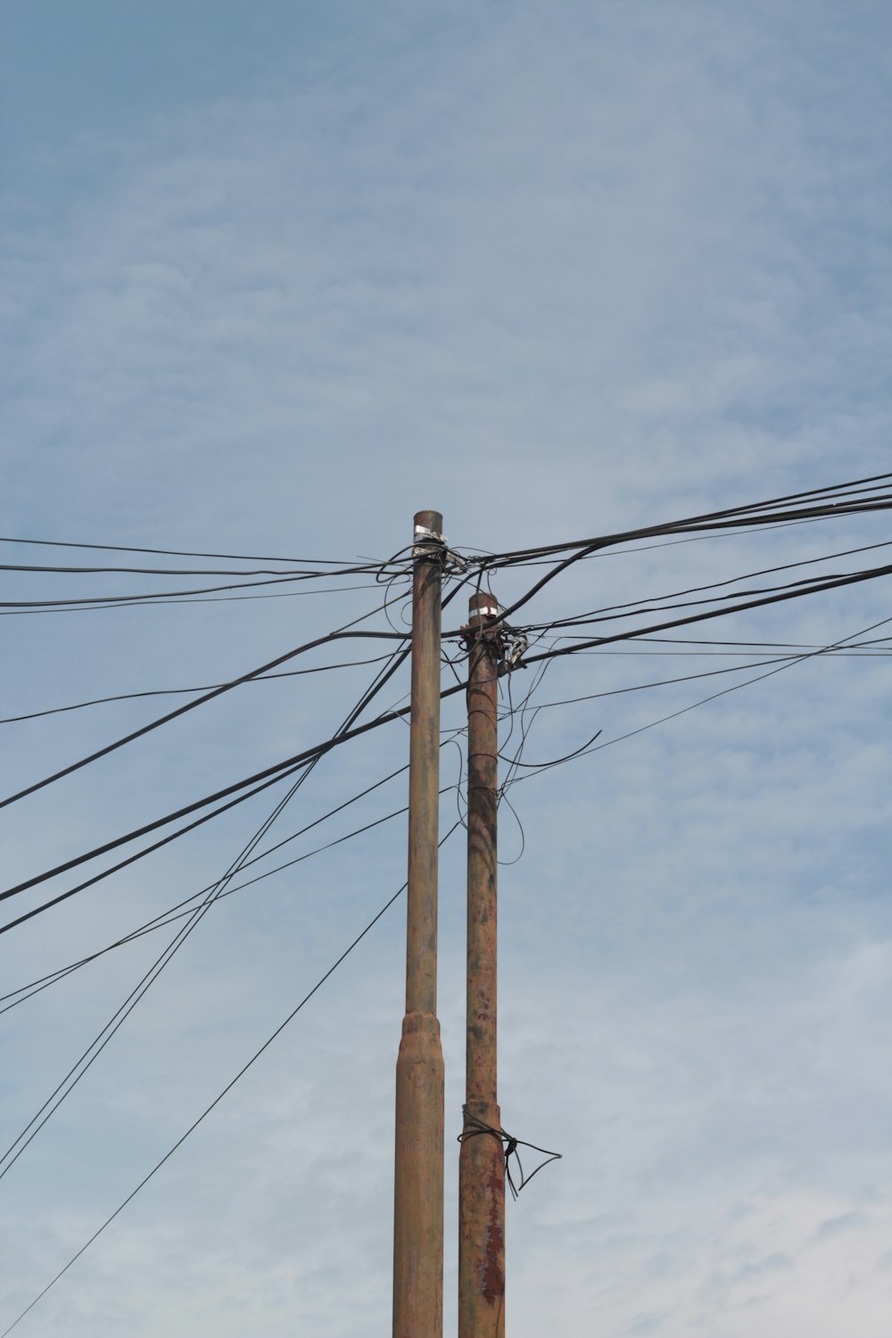 a telephone pole with a bunch of wires attached to it