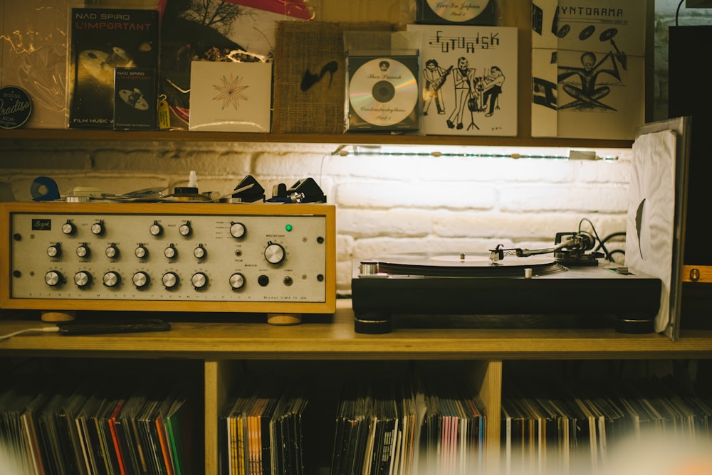 a record player sitting on top of a wooden table