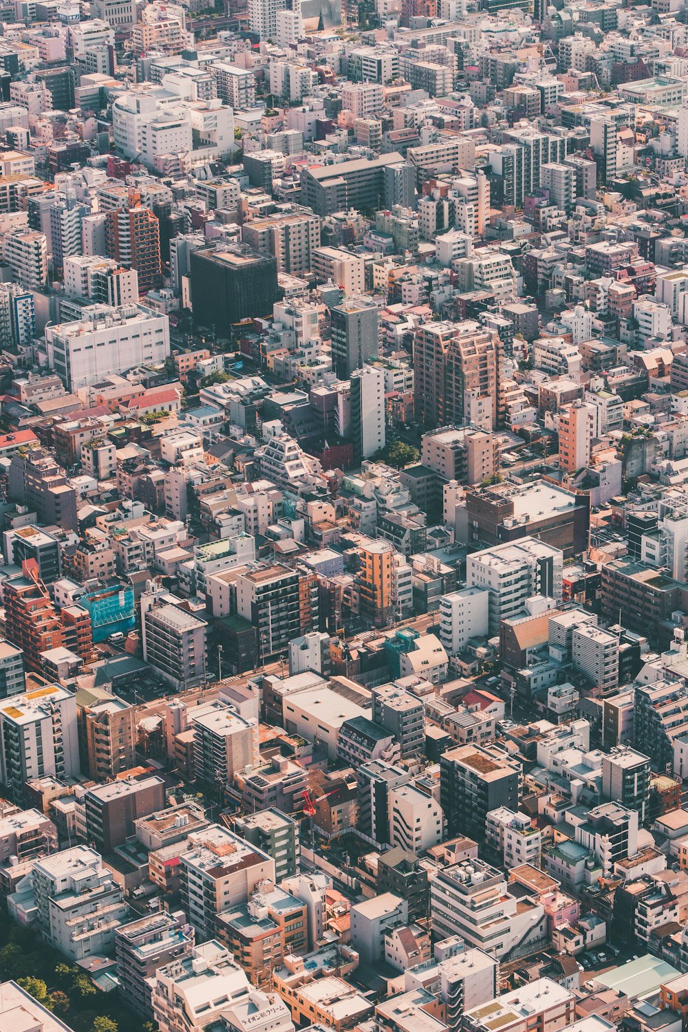 an aerial view of a city with tall buildings