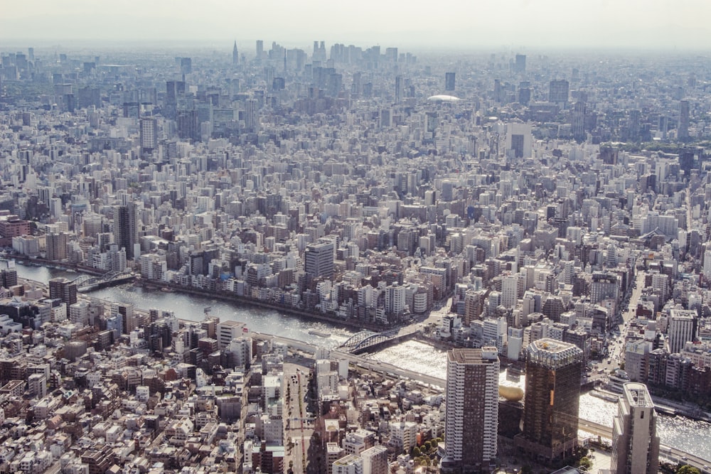 an aerial view of a city with a river running through it