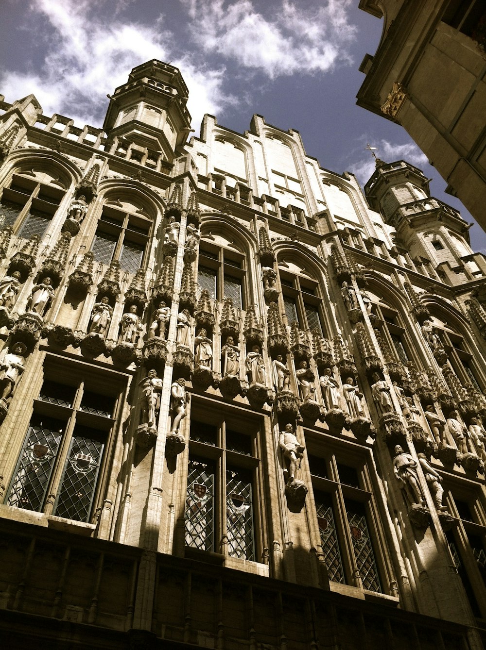 a tall building with lots of windows and balconies