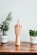 a wooden sculpture of a hand is on a table