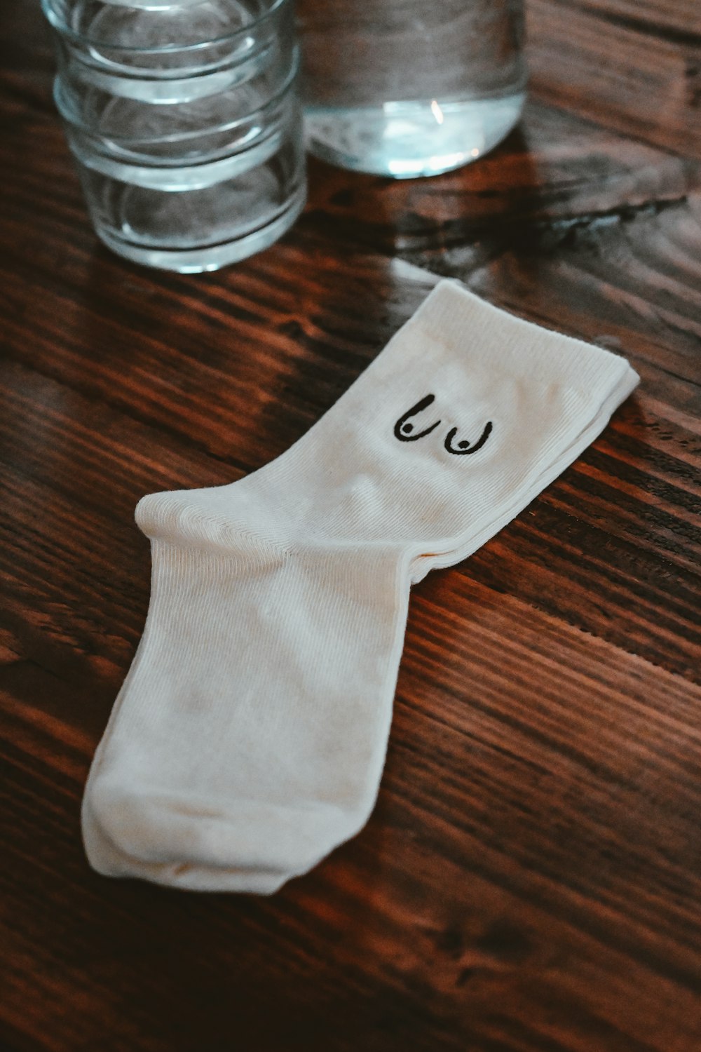 a pair of socks sitting on top of a wooden table