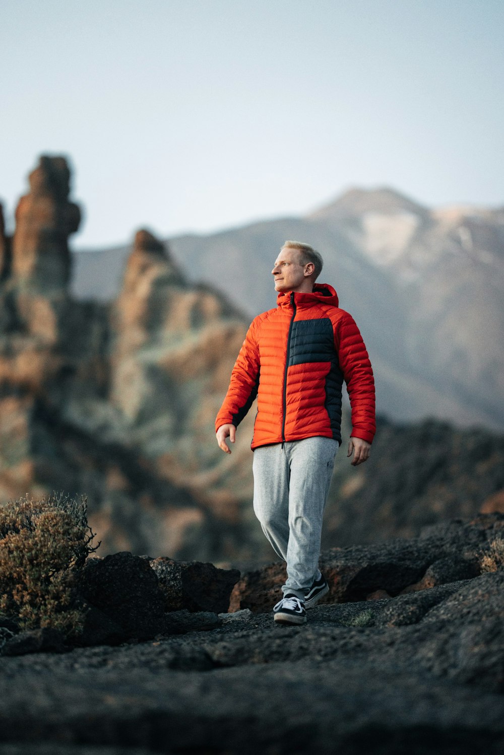 a man standing on top of a rocky mountain