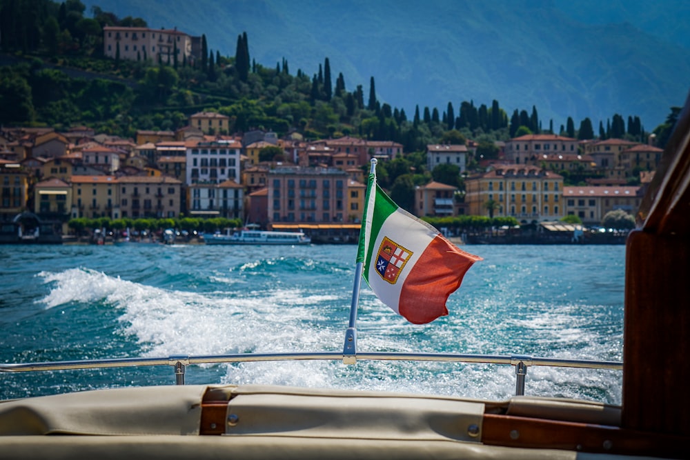 a boat with a flag on the back of it