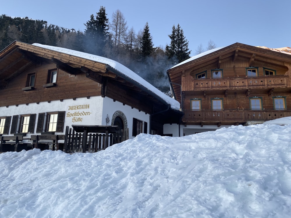 a snow covered hill with a building in the background