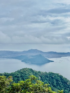 a large body of water surrounded by trees