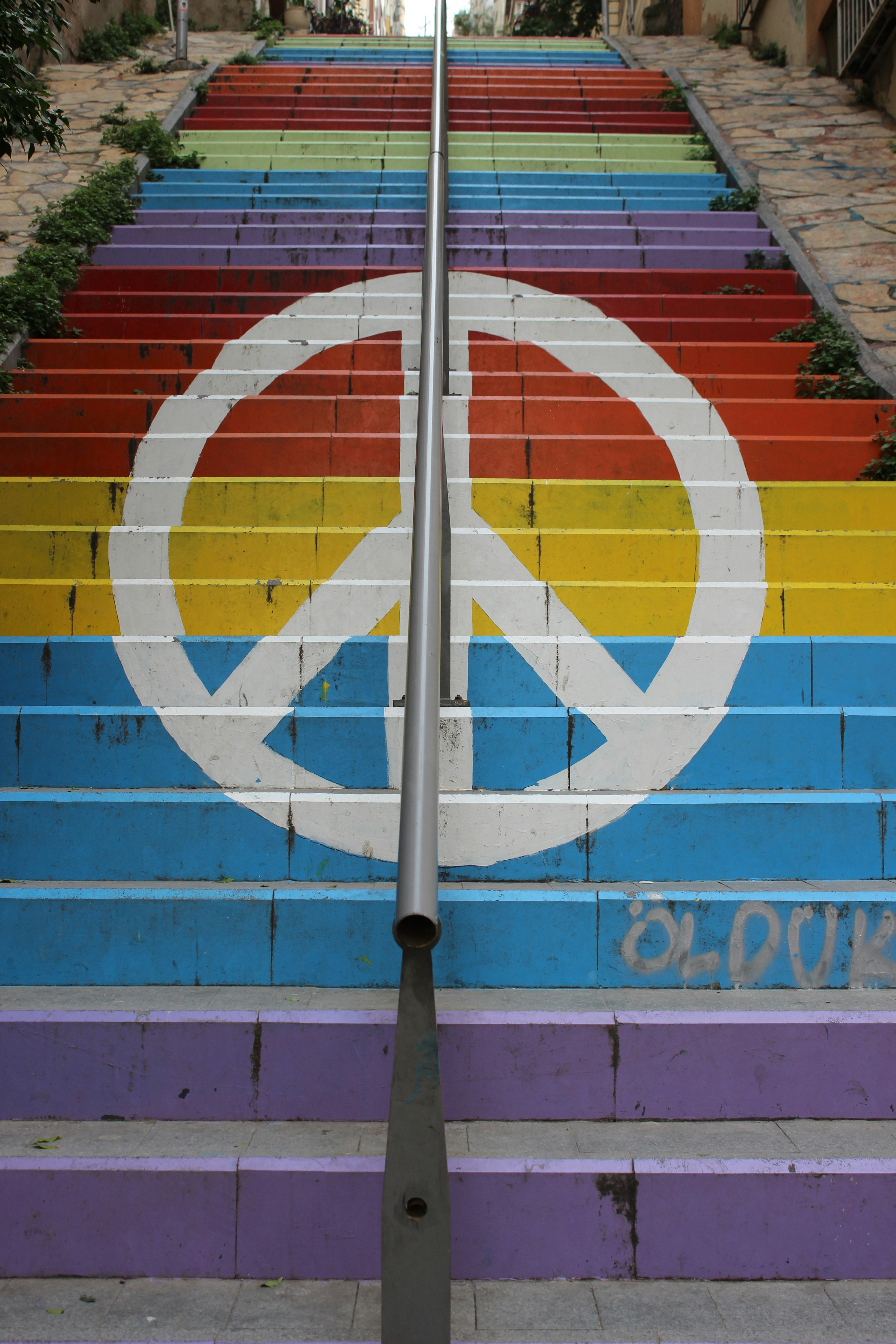 a set of colorful steps painted with a peace sign