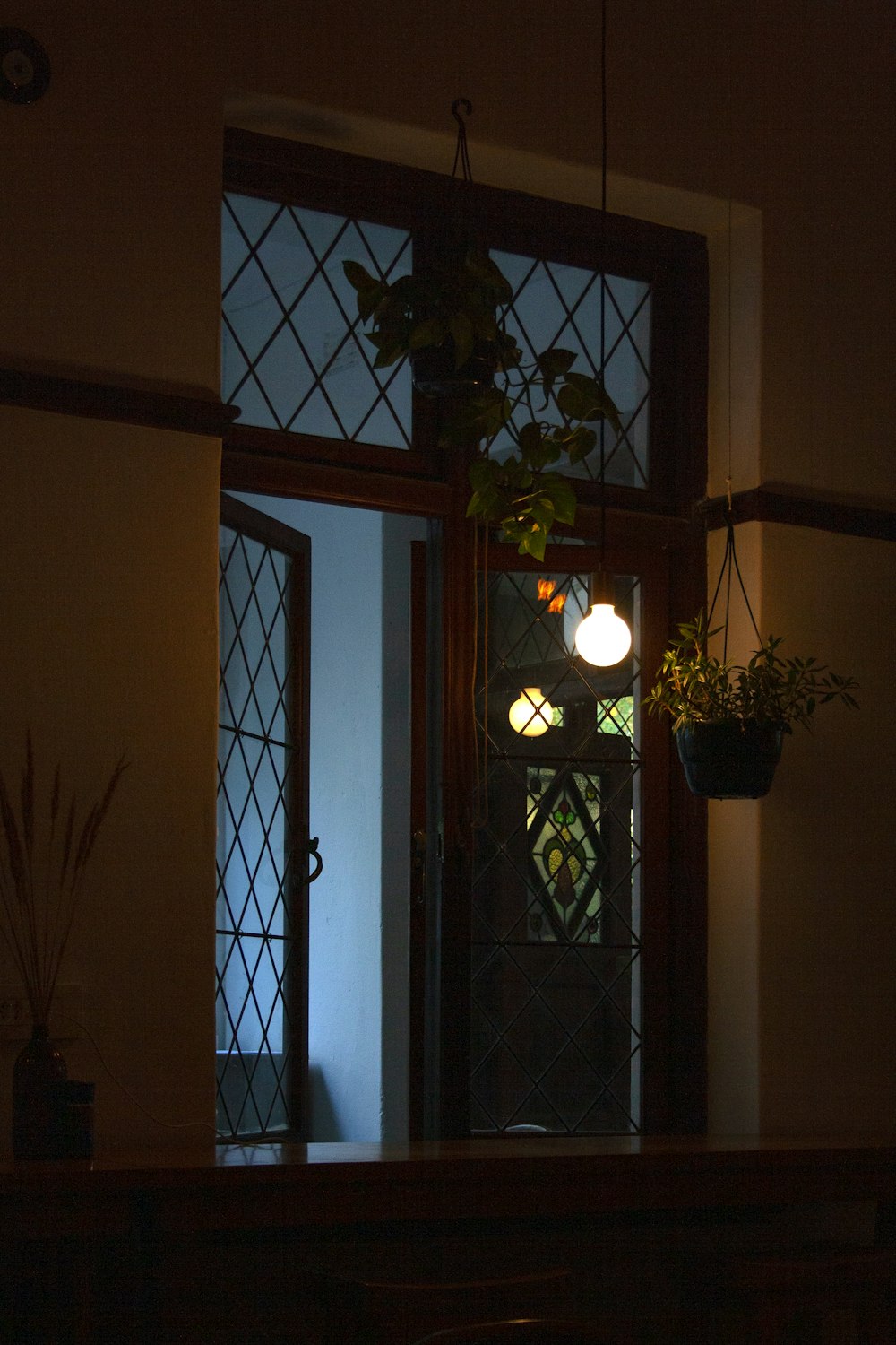 a dark room with a door and a window