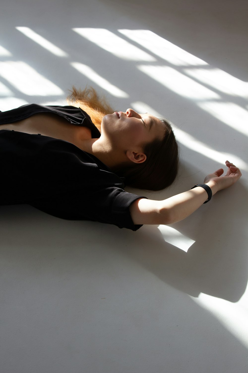 a woman laying on the floor in a room