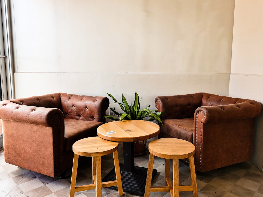 a couple of chairs and a table in a room