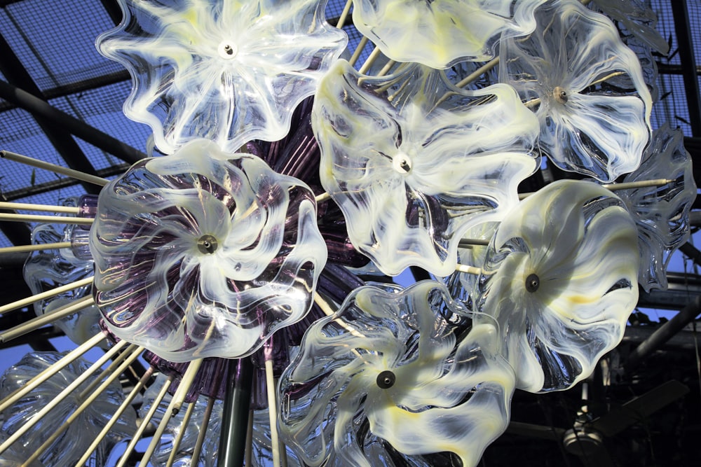 a close up of a glass sculpture with flowers on it