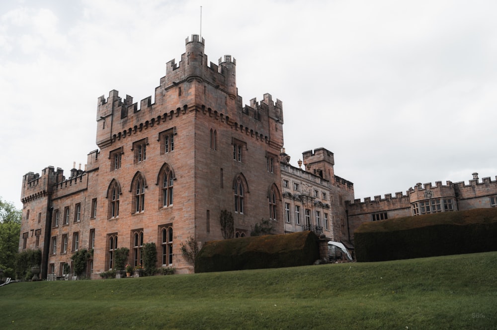 a large brick building with a tall tower