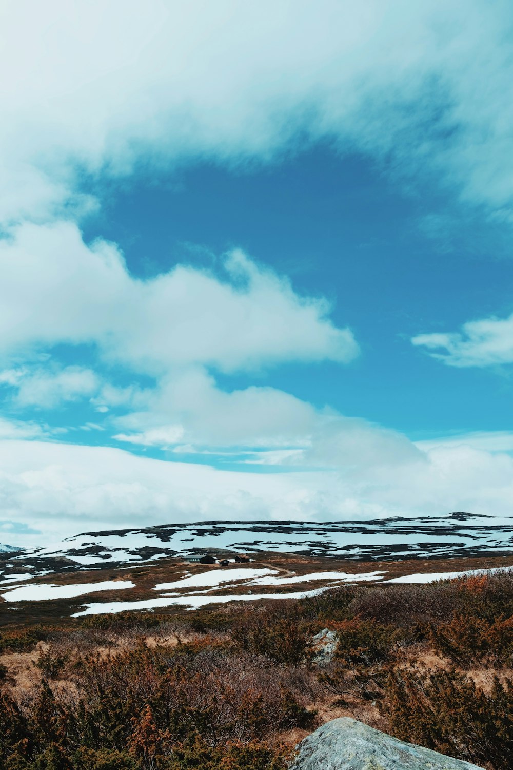 a rocky outcropping with a blue sky in the background